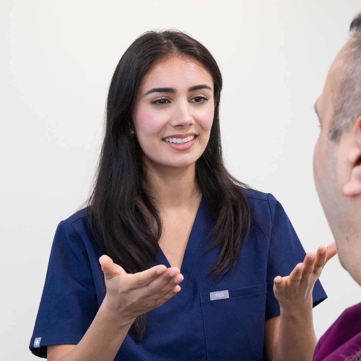 Dr Nenah performing aesthetic treatment